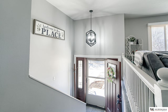 entrance foyer featuring a notable chandelier