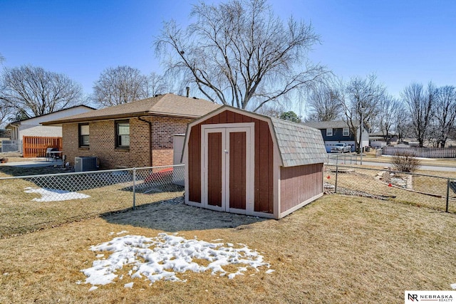 view of shed featuring a fenced backyard and central AC