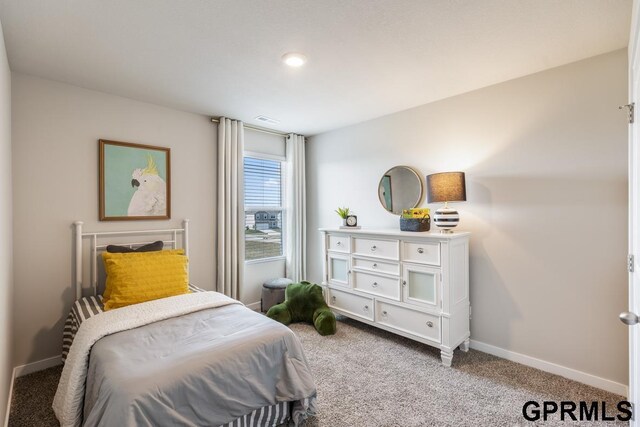 bedroom with carpet flooring, visible vents, and baseboards