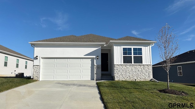 view of front of property featuring driveway, a front lawn, stone siding, board and batten siding, and a garage