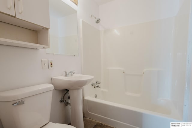 full bath featuring toilet, shower / bathing tub combination, and a sink