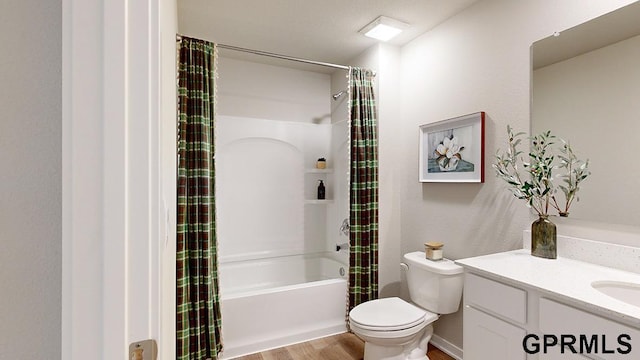 full bath featuring vanity, toilet, wood finished floors, and shower / bath combo with shower curtain