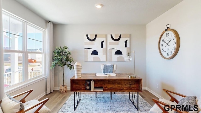 office with wood finished floors and baseboards