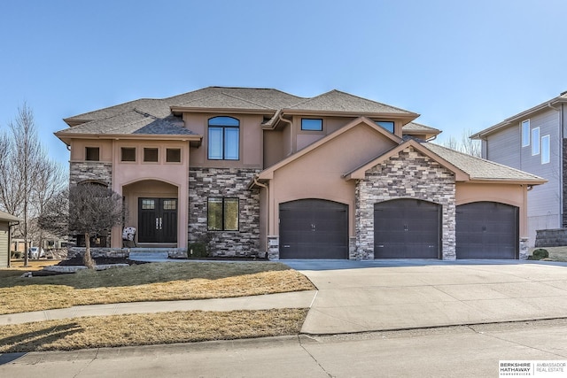 view of front facade featuring stone siding, stucco siding, concrete driveway, and a garage