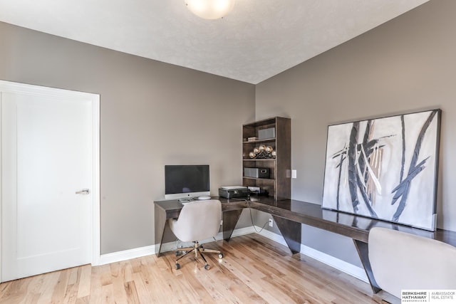 office with baseboards and wood finished floors