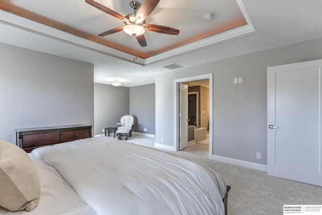 carpeted bedroom with visible vents, a raised ceiling, baseboards, and ceiling fan