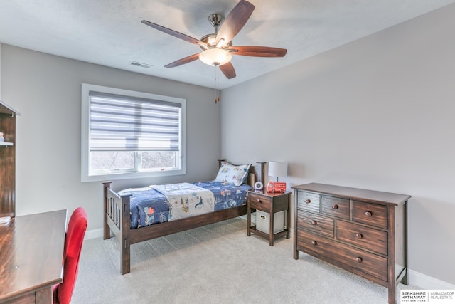 bedroom featuring light carpet, visible vents, ceiling fan, and baseboards