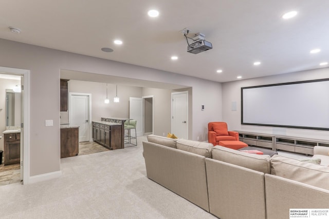 home theater featuring recessed lighting, baseboards, and light carpet