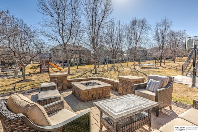 view of patio featuring an outdoor living space with a fire pit, stairway, a trampoline, and playground community