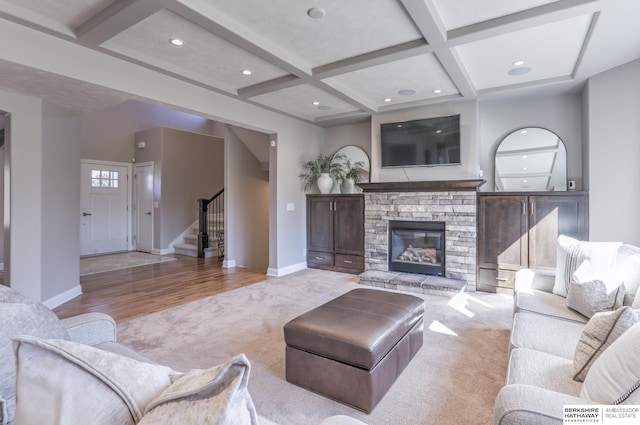 living area with stairway, beamed ceiling, coffered ceiling, and baseboards