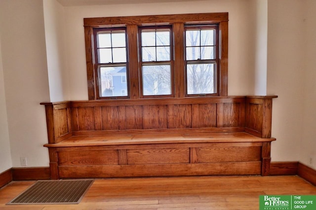 interior details featuring baseboards and wood finished floors