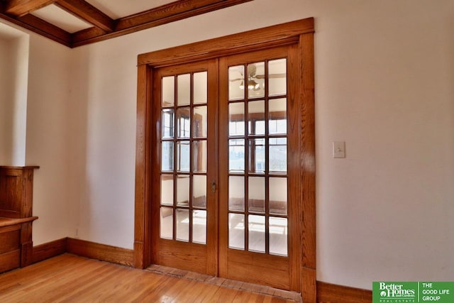 doorway to outside featuring beam ceiling, french doors, light wood-type flooring, and baseboards