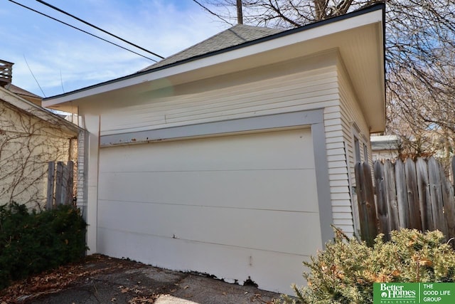 garage with fence