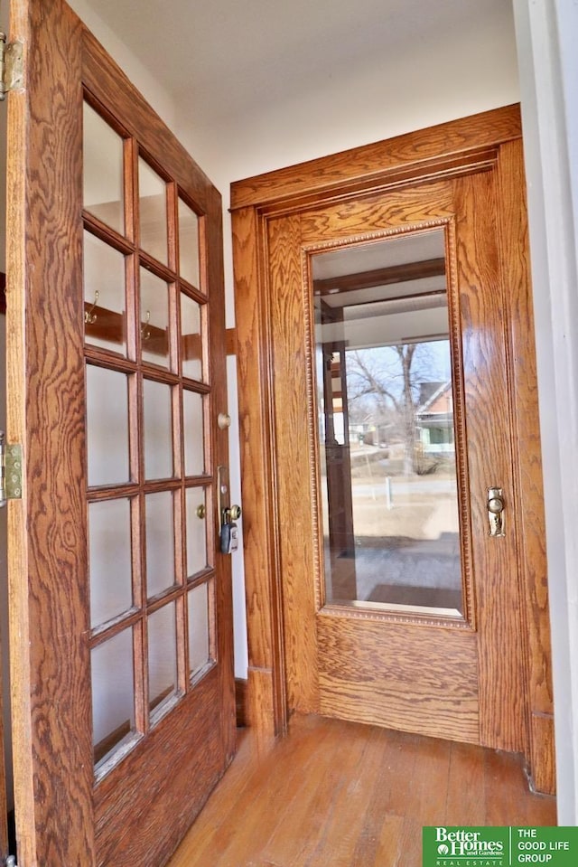 doorway with hardwood / wood-style floors