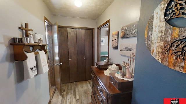 corridor with wood finished floors