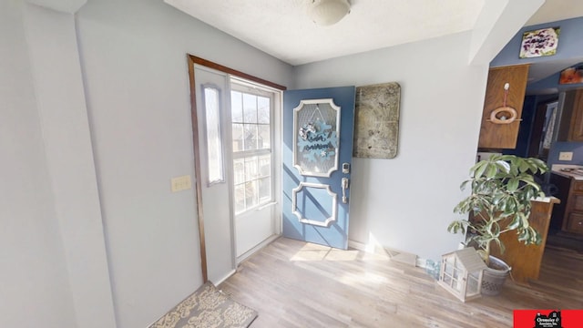 doorway to outside featuring wood finished floors