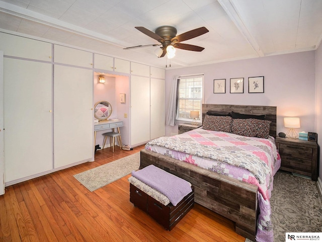 bedroom featuring ceiling fan and wood finished floors