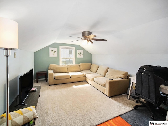 living area featuring lofted ceiling, light carpet, and ceiling fan