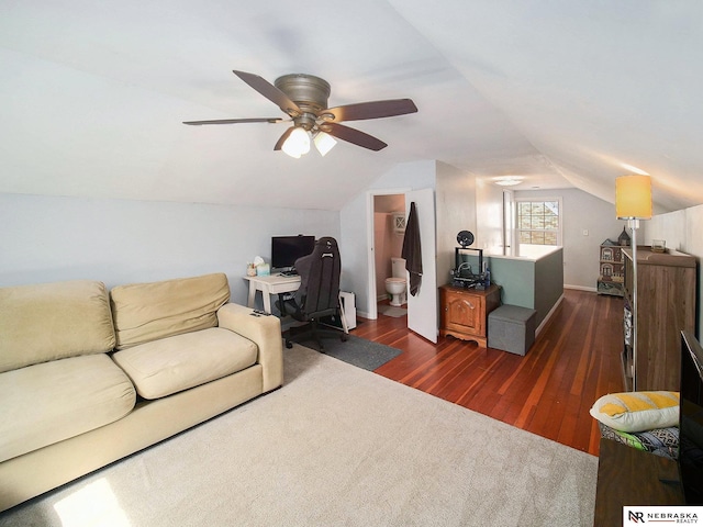 living room with ceiling fan, baseboards, dark wood finished floors, and vaulted ceiling