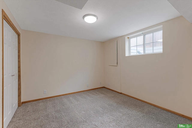 unfurnished room featuring baseboards and carpet floors