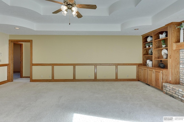 empty room featuring recessed lighting, visible vents, a raised ceiling, and light carpet