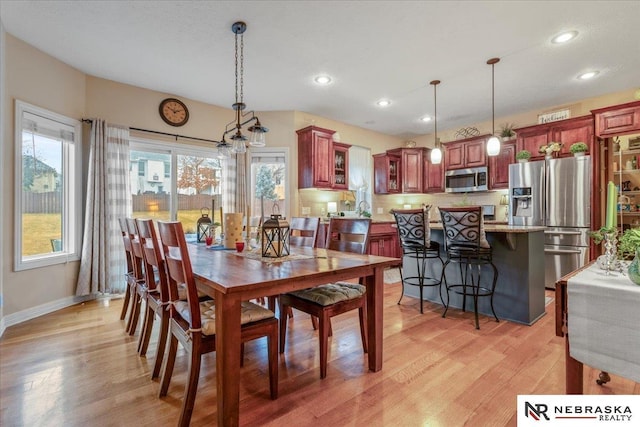 dining area featuring recessed lighting, light wood-style floors, and a healthy amount of sunlight