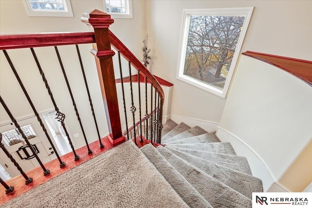 stairway featuring wood finished floors