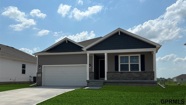 craftsman inspired home with stone siding, an attached garage, driveway, and a front yard