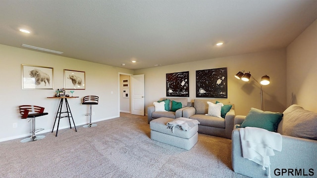 living room with recessed lighting, carpet, and baseboards