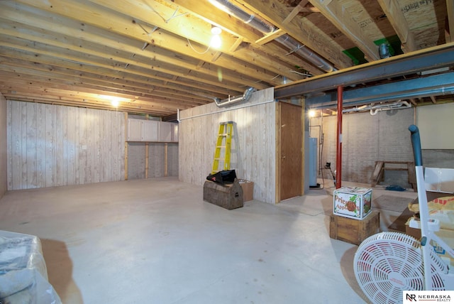 unfinished basement with water heater