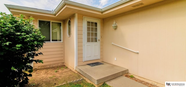 entrance to property with visible vents