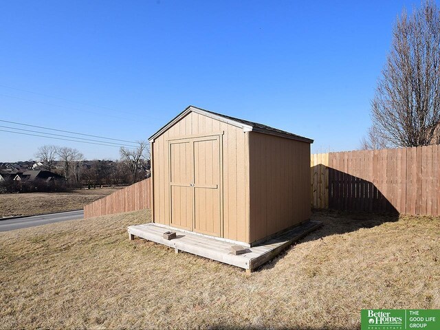 view of shed with a fenced backyard