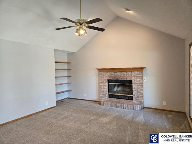 unfurnished living room featuring a brick fireplace, baseboards, carpet, and ceiling fan