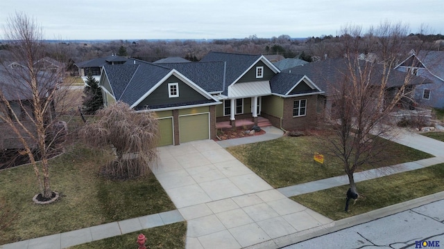 view of front facade featuring brick siding, concrete driveway, a front yard, roof with shingles, and a garage