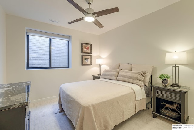 bedroom with visible vents, baseboards, and ceiling fan