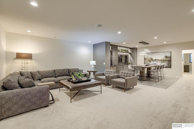 living room with recessed lighting and baseboards