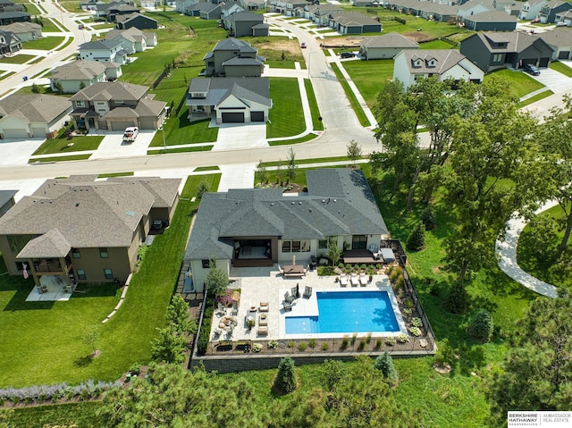 birds eye view of property with a residential view