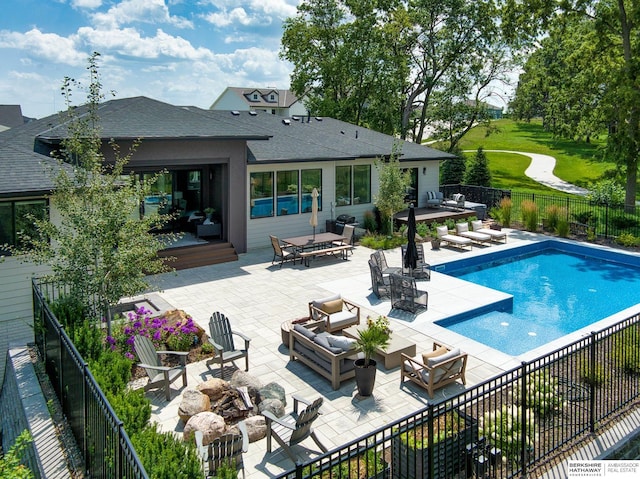 view of swimming pool featuring a patio, a fenced backyard, an outdoor living space with a fire pit, outdoor dining area, and a fenced in pool