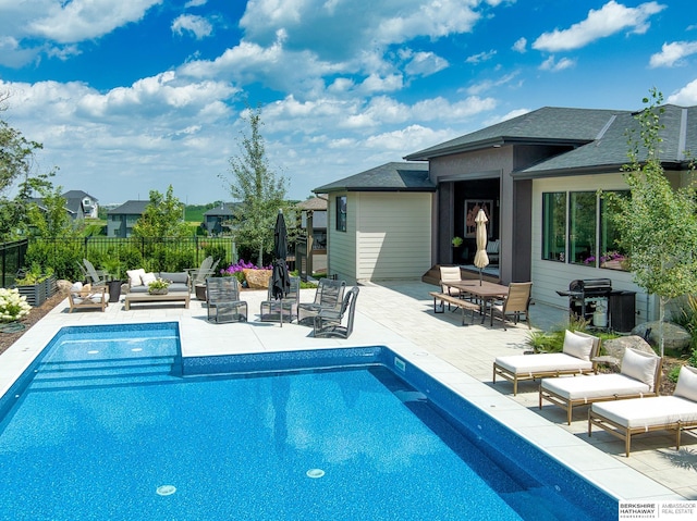 view of swimming pool with a fenced in pool, a patio, area for grilling, and fence