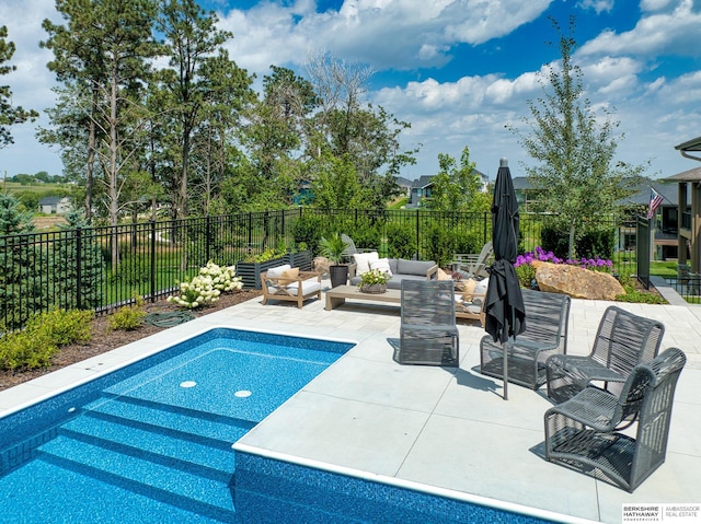 view of swimming pool featuring an outdoor hangout area, a patio, and fence