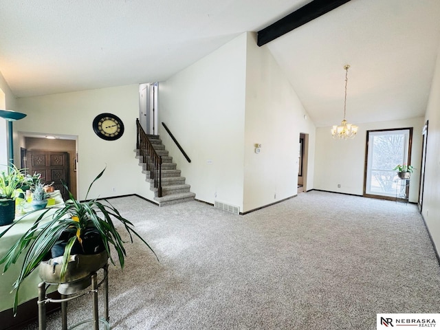 unfurnished living room featuring visible vents, beam ceiling, carpet, a chandelier, and stairs