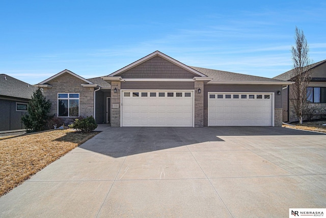 view of front facade featuring concrete driveway and a garage