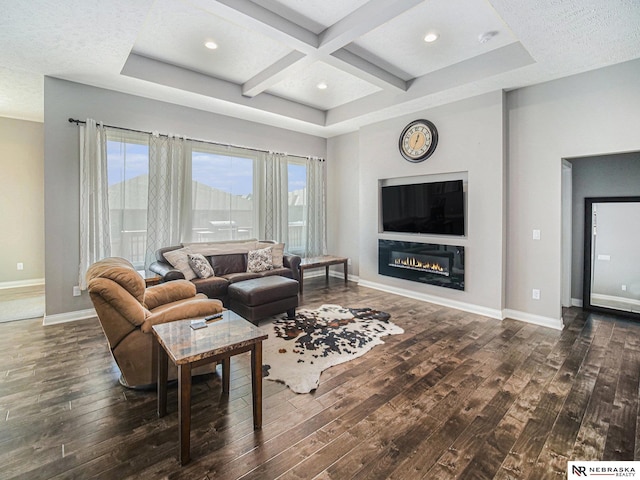 living room with hardwood / wood-style floors, plenty of natural light, baseboards, and coffered ceiling