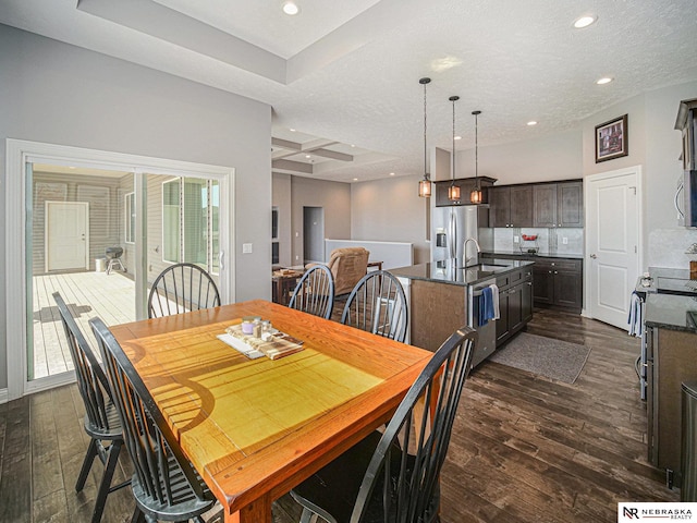 dining space with recessed lighting, coffered ceiling, and dark wood-type flooring