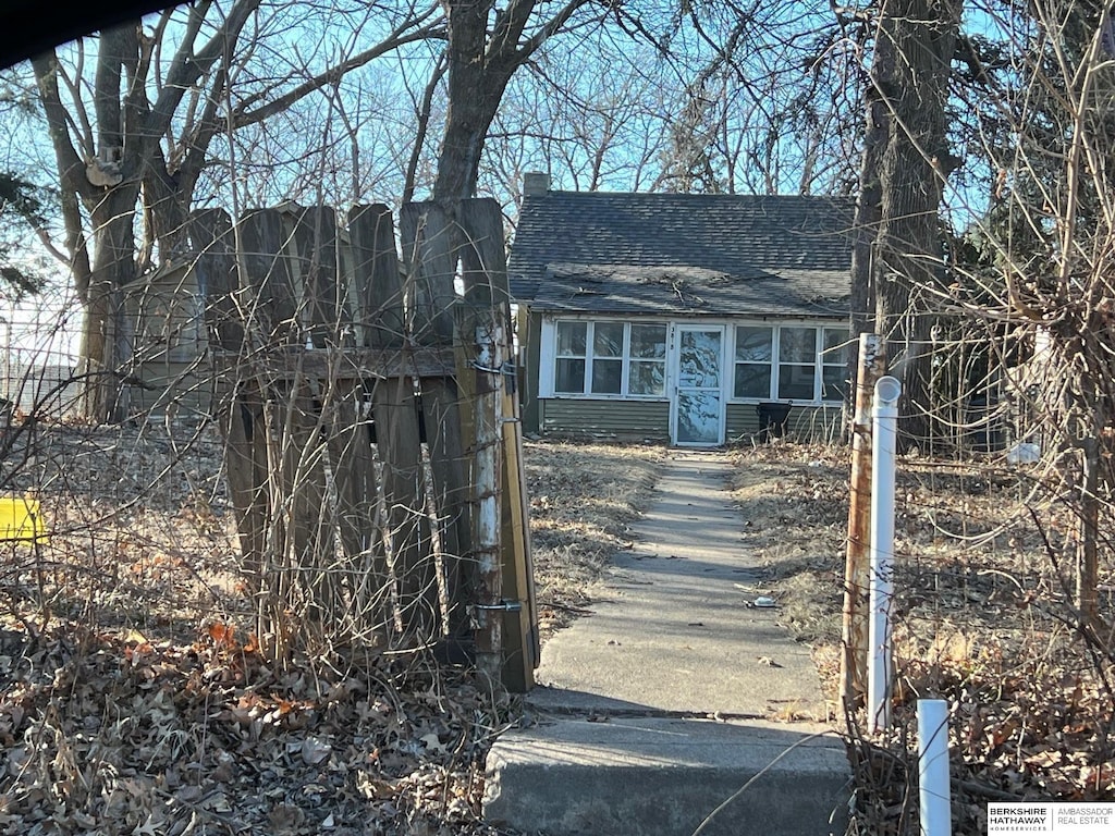 view of front of house with a shingled roof