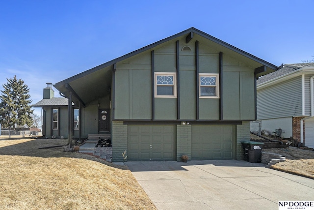 view of front of property with brick siding, board and batten siding, concrete driveway, and a garage