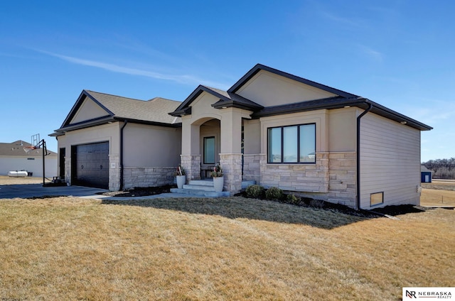 view of front of property featuring stone siding, stucco siding, an attached garage, and a front yard