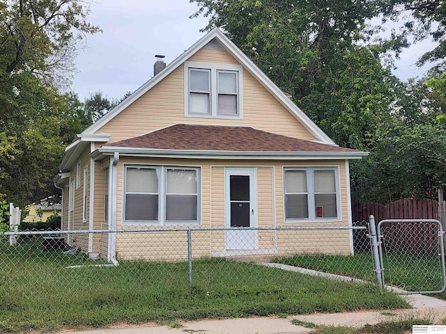 bungalow with a fenced front yard, a front yard, a chimney, and a shingled roof