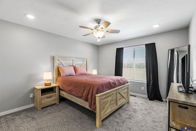 carpeted bedroom featuring recessed lighting, ceiling fan, and baseboards