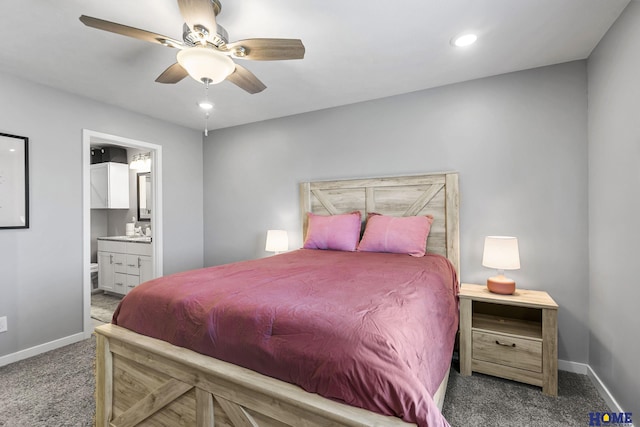 bedroom with recessed lighting, baseboards, carpet, and ensuite bath